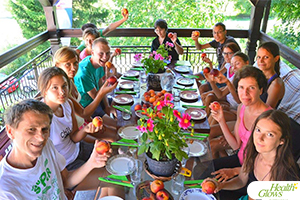 A group photo at one of the raw vegan lunches at the "Health Glows Weekend", 26th -28th August 2016, in Vrujci Spa, Serbia. At the 'Health Glows Weekend', guests learn in theory and practice how to eat a raw vegan diet, exercise daily and maintain a high level of health long-term through a healthy lifestyle.