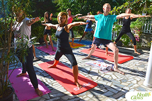 A yoga class at the "Health Glows Weekend", 26th -28th August 2016, in Vrujci Spa, Serbia. At the 'Health Glows Weekend', guests learn in theory and practice how to eat a raw vegan diet, exercise daily and maintain a high level of health long-term through a healthy lifestyle.