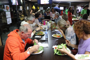 Participants enjoy a raw vegan dinner at the 'Adriatic Fruit Festival', October 2022 in Ulcinj, Montenegro. At the 'Serbian Fruit Festival', guests learn in theory and practice how to eat a raw vegan diet, exercise daily and maintain a high level of health long-term through a healthy lifestyle.