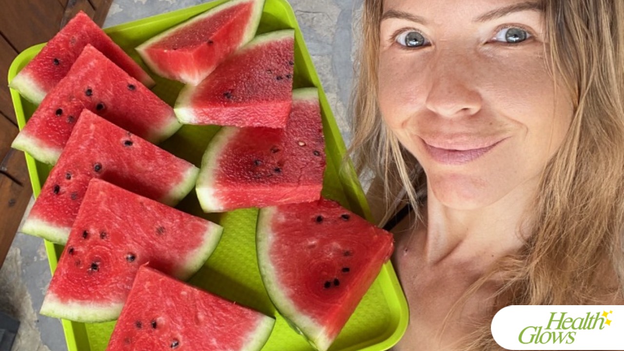 The organiser of the supervised water fast in Serbia, serving slices of watermelon of a tray to her clients after their fasts.