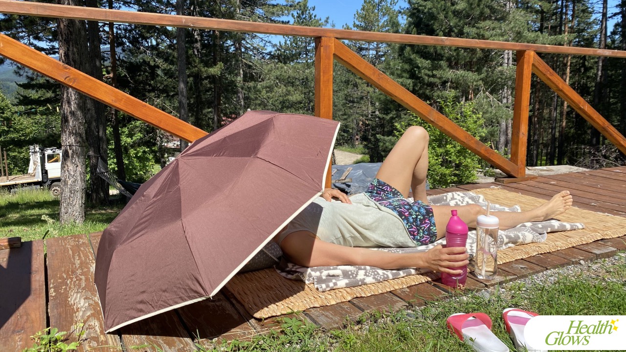 A supervised water fast client in Serbia in 2022, resting with a glass of water during her 3-week water fast.