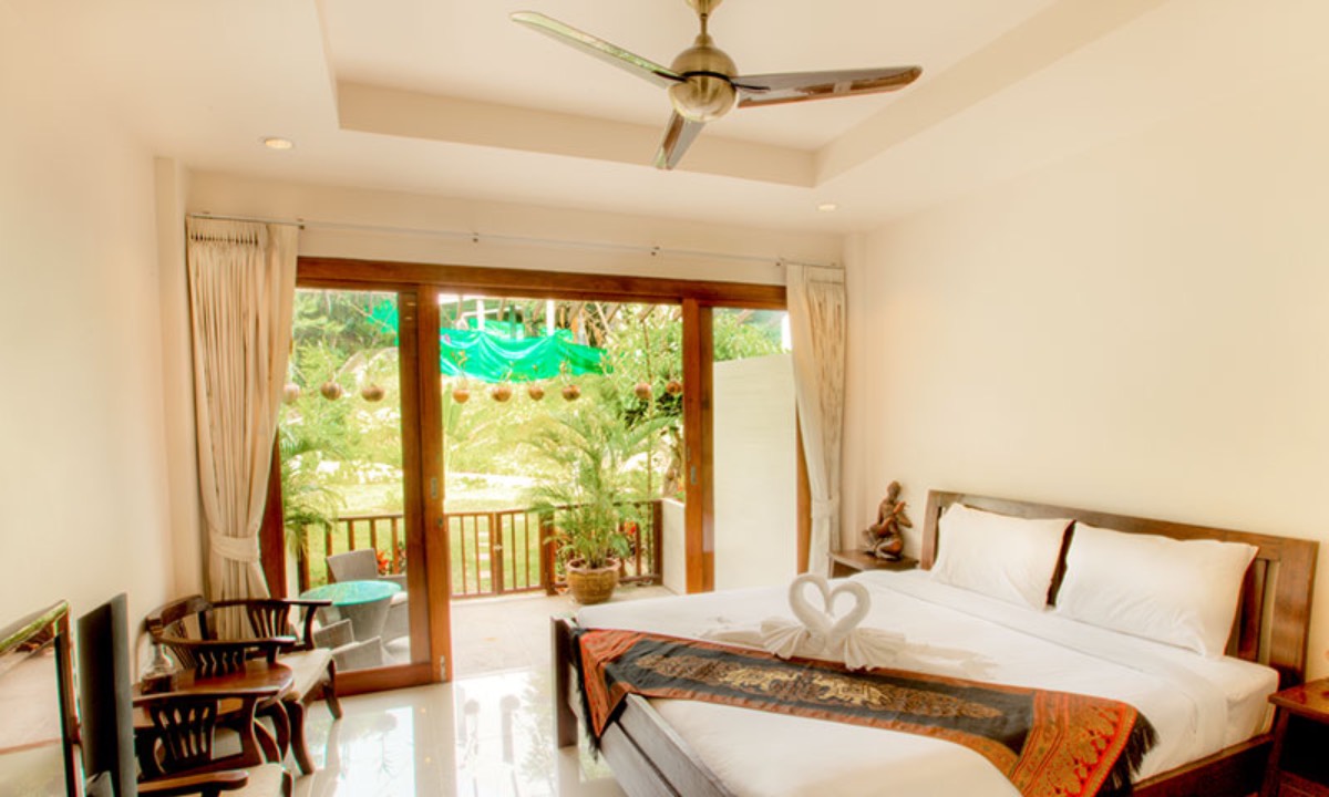 Deluxe room with a balcony for a couple at the 'Health Glows Thai Retreat' 2025.
