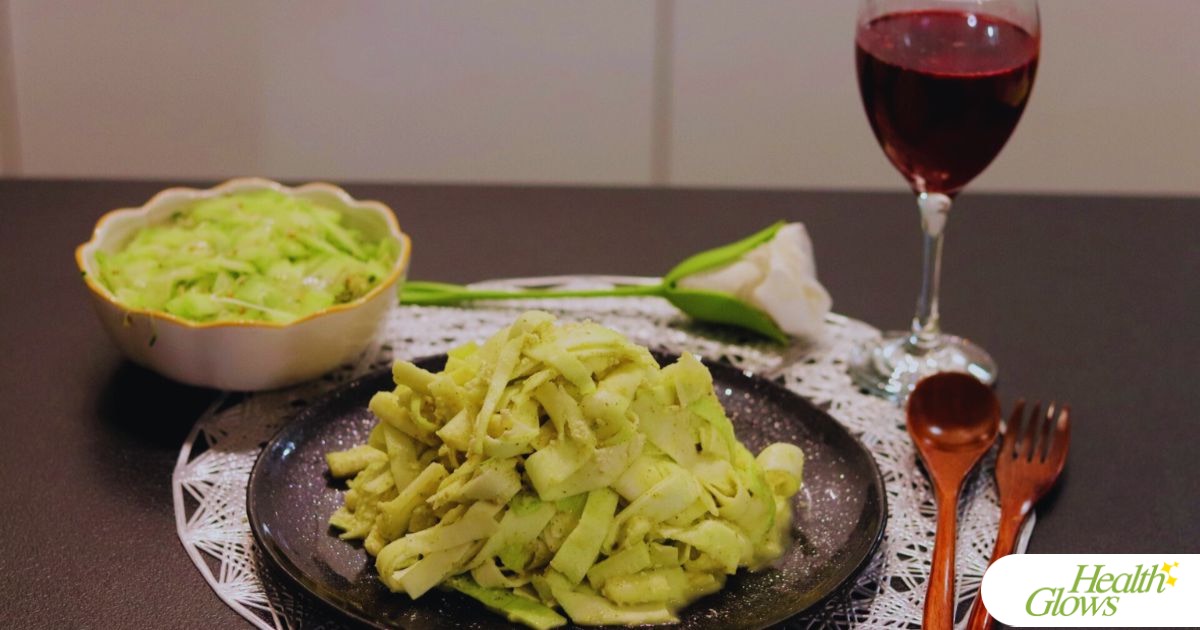 An example of a raw vegan dinner: raw vegan mac and cheese, a cucumber-microgreen salad, pomegranate-orange juice.