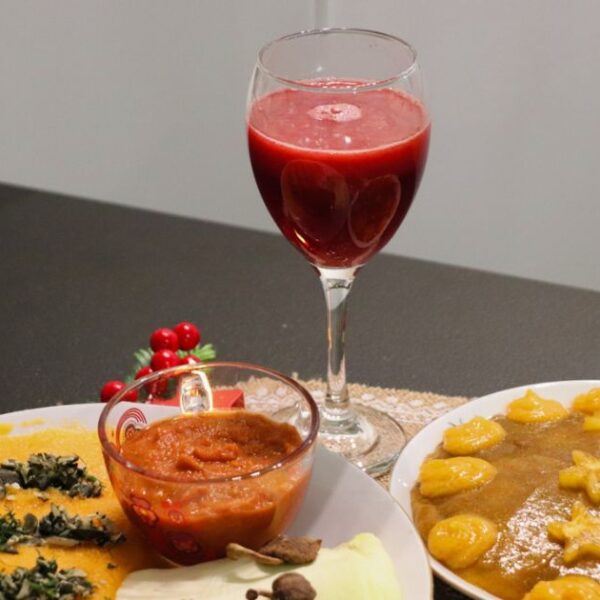 Food from the 'Raw Vegan New Year's Eve Raw Vegan Dinner Culinary Class' placed on the table, photographed from front and close-up.
