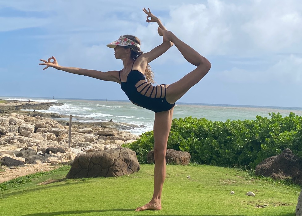 Marina from Health Glows in the 'Dancer' yoga pose ('Natarajasana').