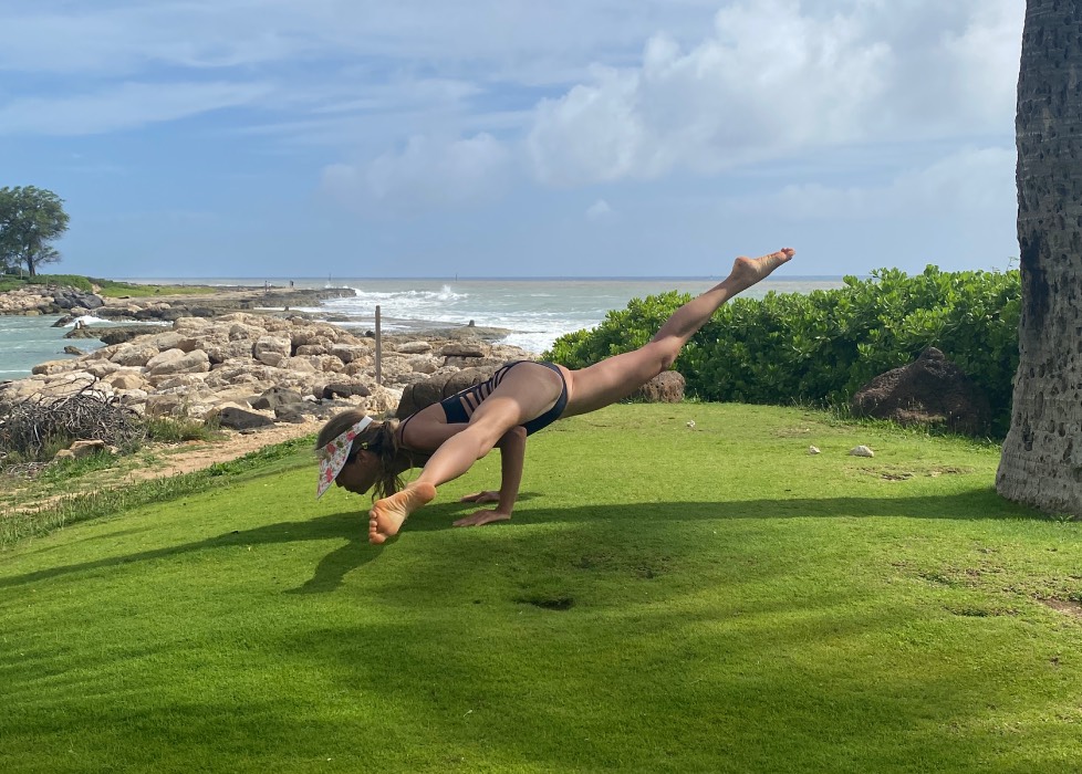 Marina from Health Glows in the 'Flying Splits' yoga pose ('Eka Pada Koundinyasana').