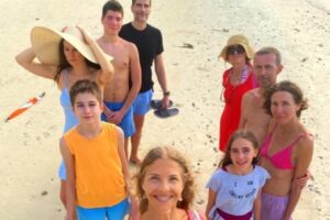 The Health Glows Thai Retreat 2025 group standing at the beach.