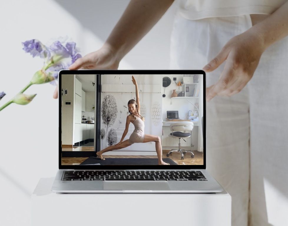 Marina from Health Glows demonstrates the 'High Lunge with Side Bend' yoga pose ('Parsva Ashta Chandrasana') on a laptop screen.