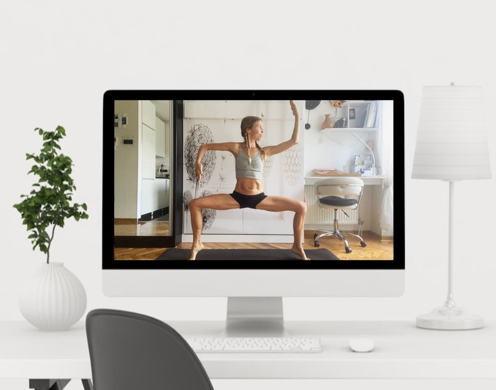 Marina from Health Glows demonstrates the 'Goddess' yoga pose ('Utkata Konasana') on a laptop screen.