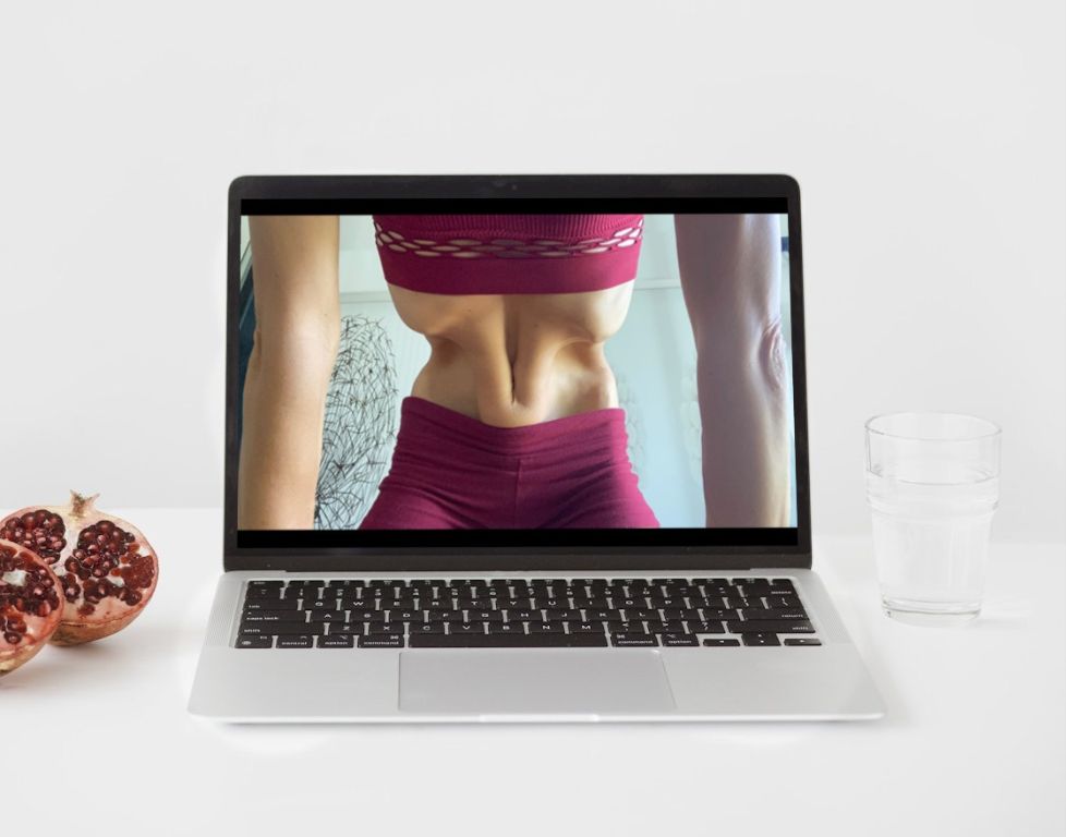 Marina from Health Glows demonstrates the 'Nauli Kriya' on a laptop screen.